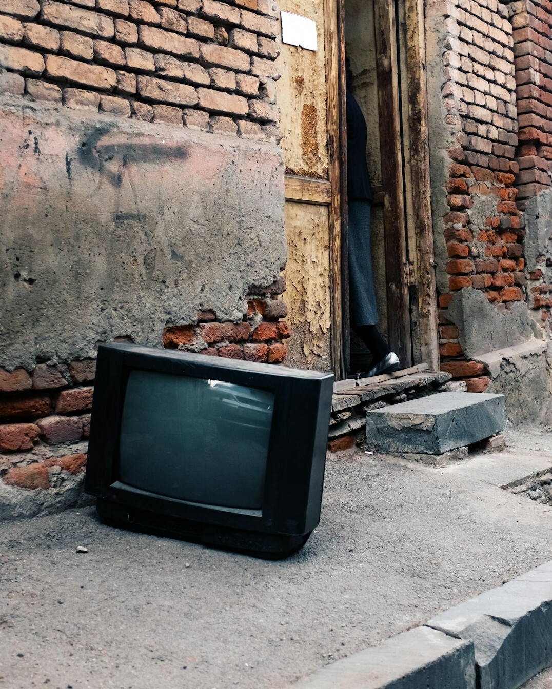 Vintage television set glowing in a dim room
